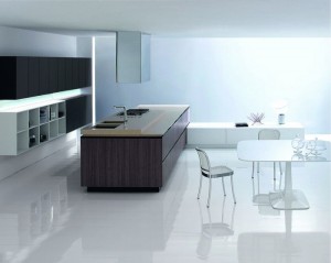 Aura in un ambiente open space propone continuità tra zona cucina e zona pranzo. (Ego Design)