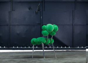 green-chair-without-arms-made-of-upholstered-on-the-seat-and-back-and-steel-on-the-legs